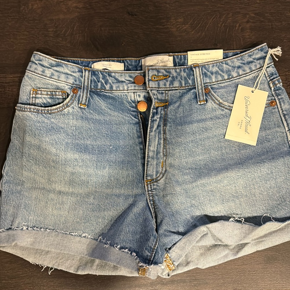 Size 4, medium wash, fitted, stretch shorts
